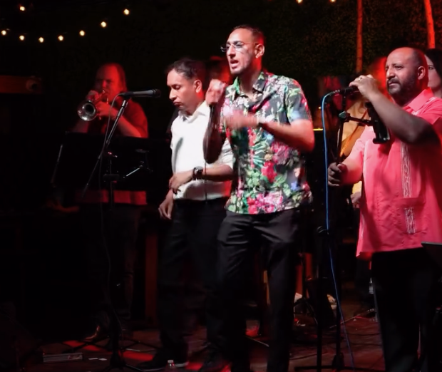 Latin band vocalists on stage